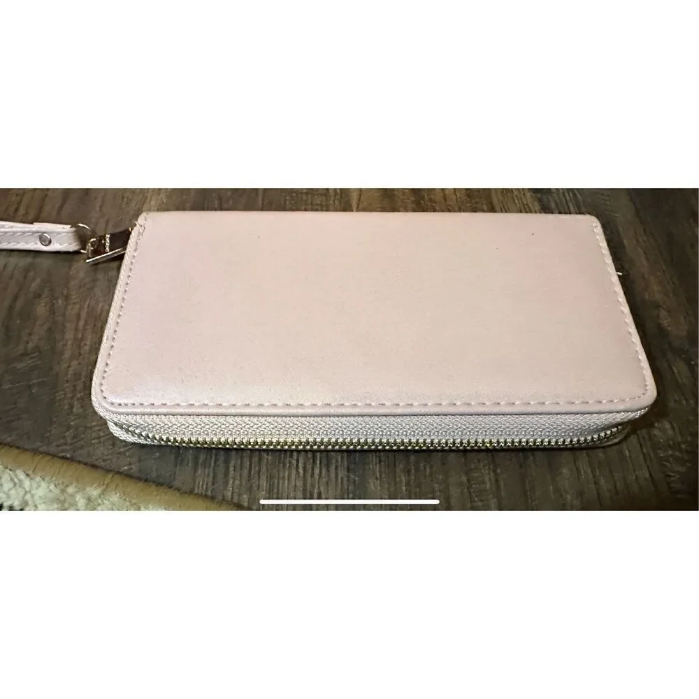 BEBE Pink and gold, large wristlet. Lots of room never used.